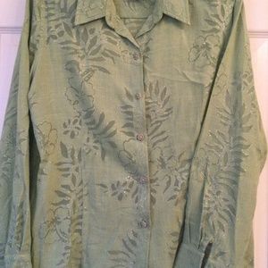 Long sleeved  pastel green fabric blouse.